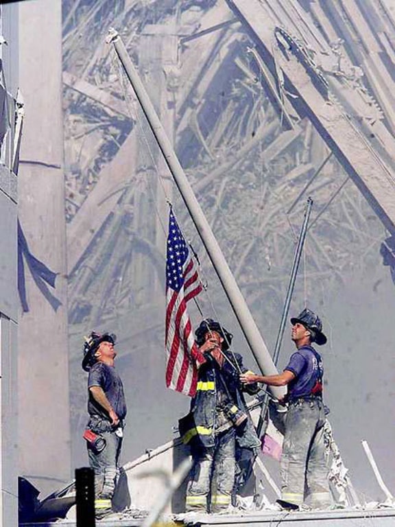 9/11 Twenty Project, 9/11 Twenty Year memorial, NYFD, NYFD Firefighters raised a tattered American flag during 9/11